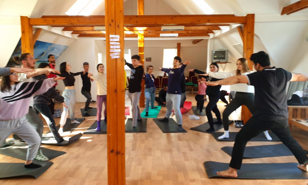 Young participants practicing yoga in Hungary during Erasmus Youth Exchange