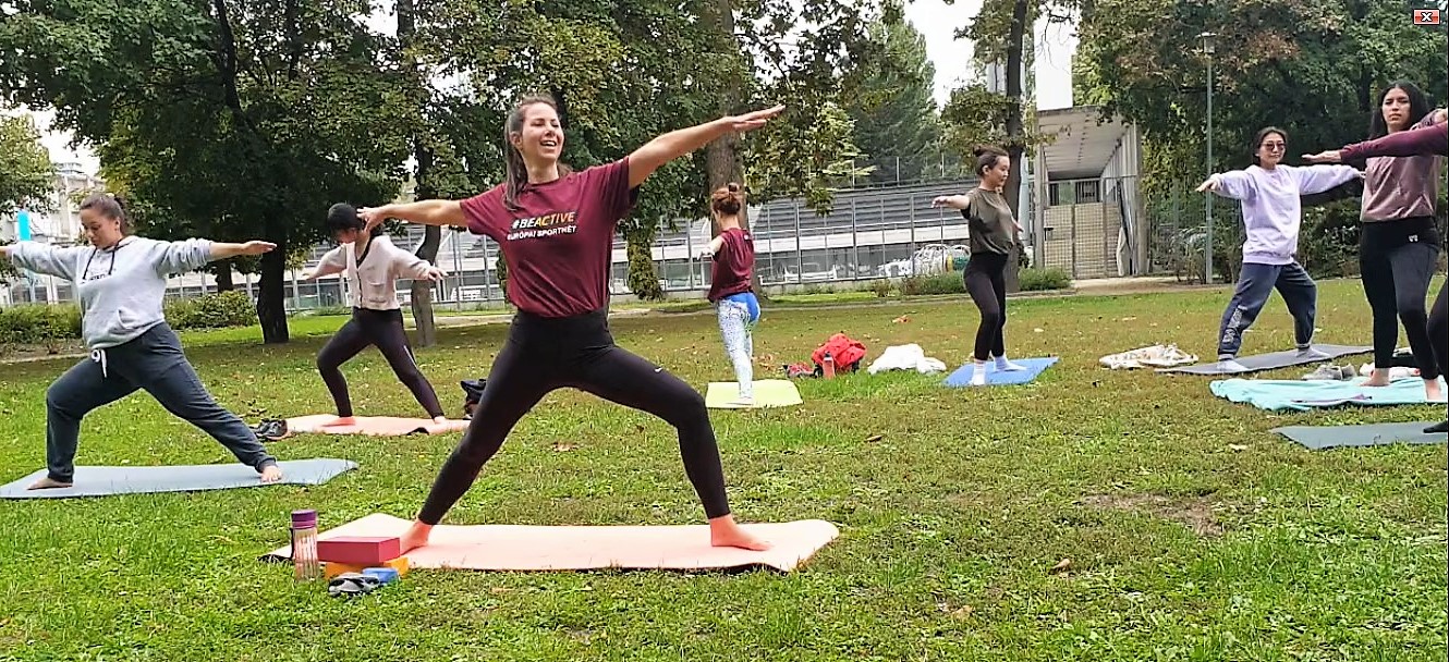 Yoga session during the European Week of Sports, people practicing outdoors